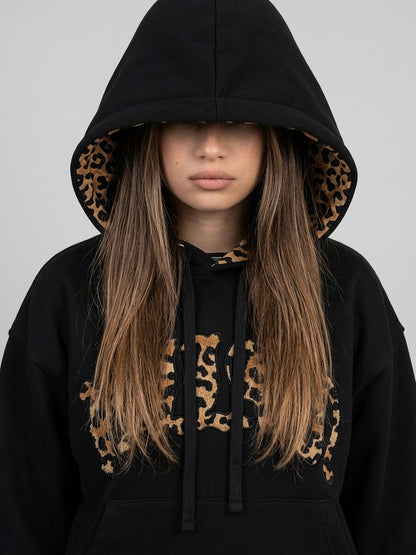 Ensemble NUVORI noir — gros plan de la doublure de capuche léopard